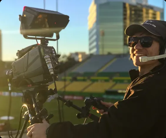 Hartley Aerial camera operator on a headset running a broadcast camera at a stadium
