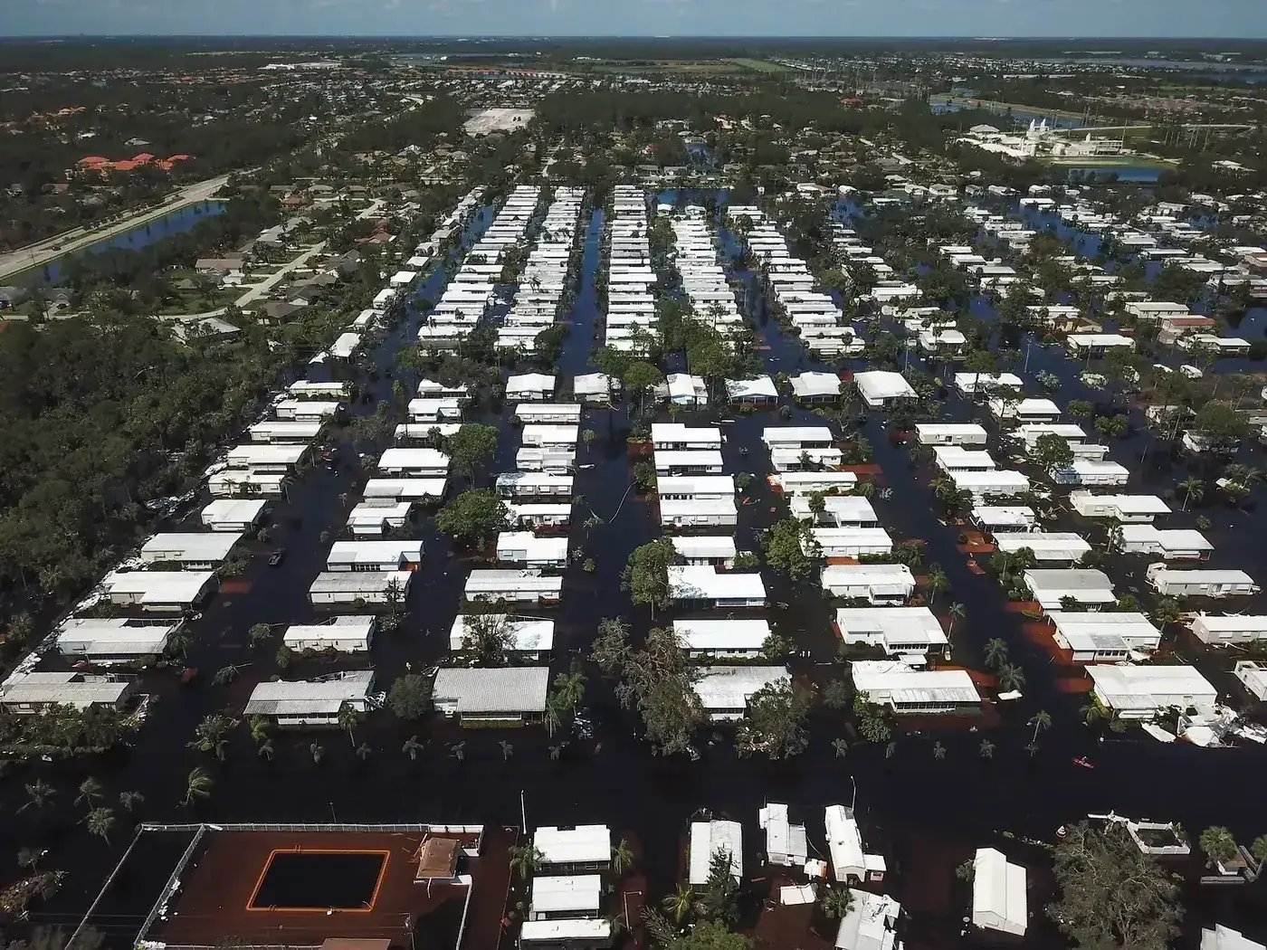 Aerial photo of a flooded mobile home community after a Florida hurricane